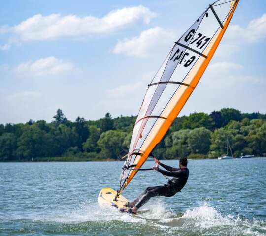 Windsurfing on Lake Ammersee Windsurfing on Lake Ammersee